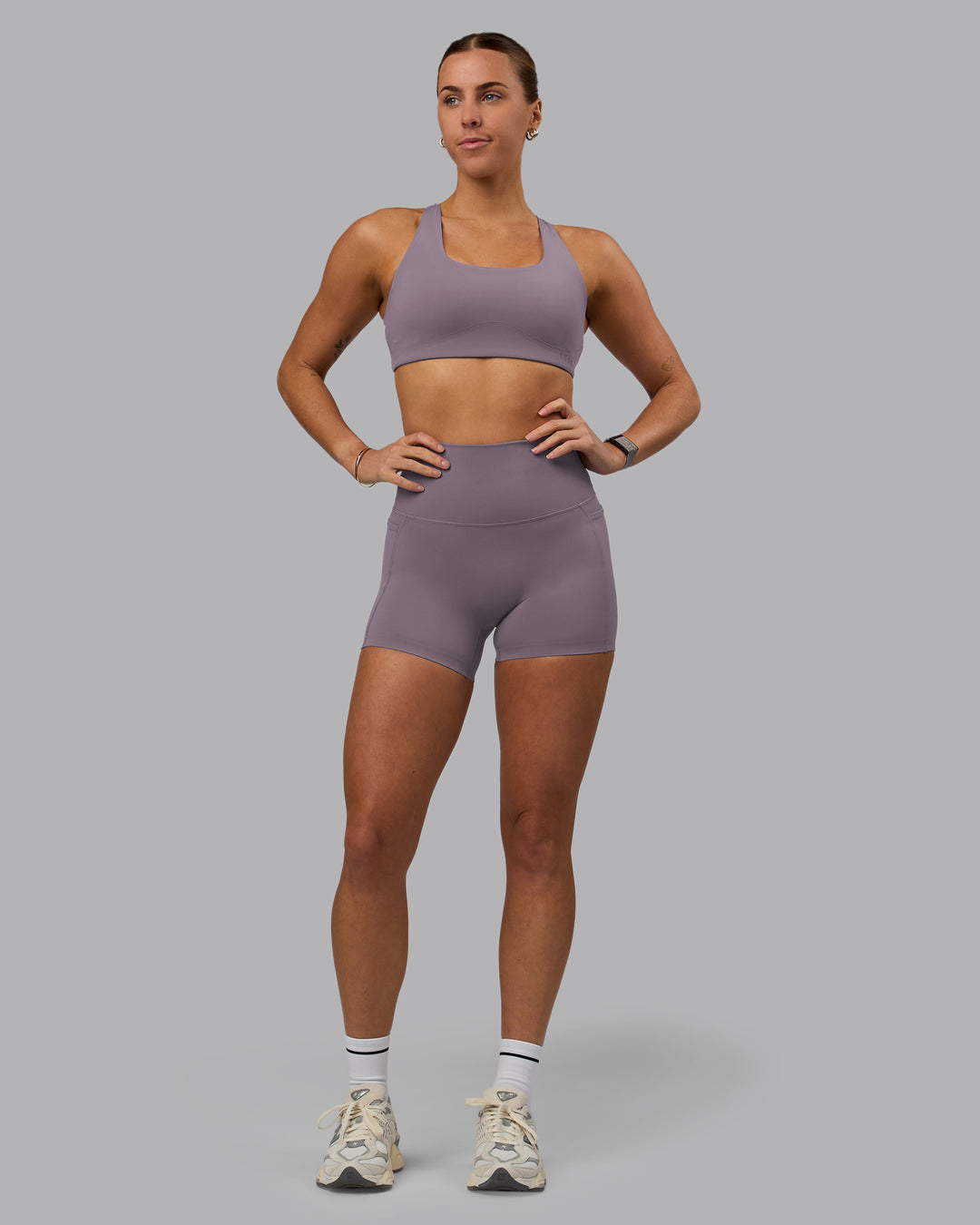 Woman wearing Aspire Sports Bra - Purple Sage - view 6