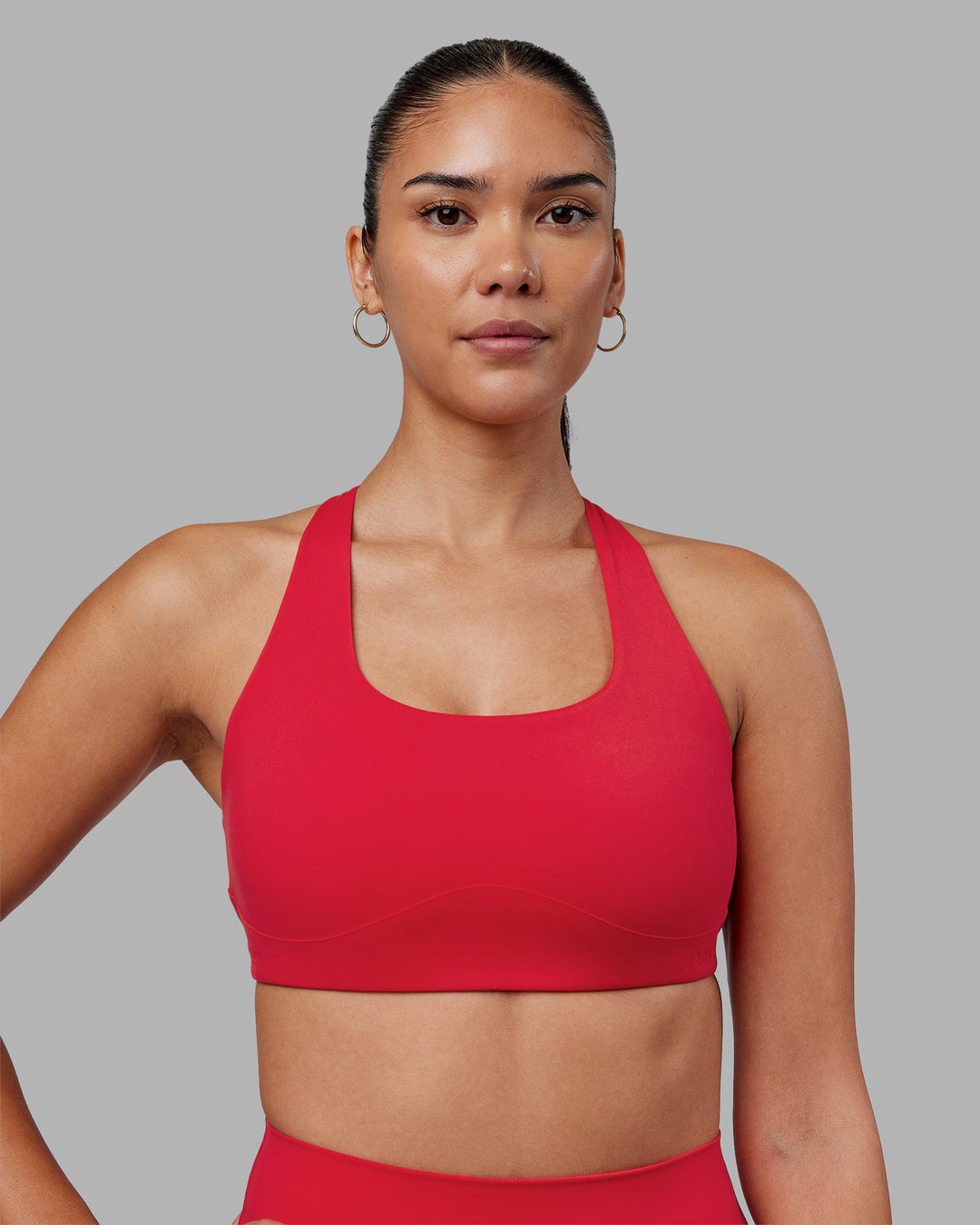Woman wearing Aspire Sports Bra - Scarlet | Model:Rhiley | Size:S - view 2