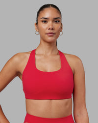 Woman wearing Aspire Sports Bra - Scarlet | Model:Rhiley | Size:S | Thumbnail Index: 1