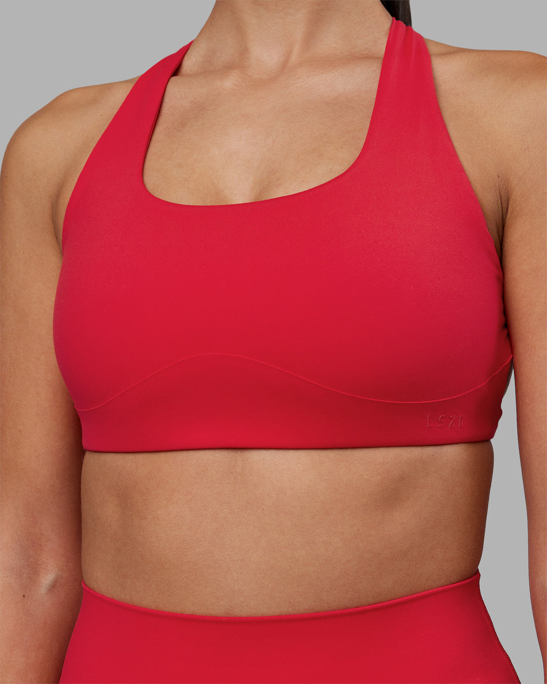 Woman wearing Aspire Sports Bra - Scarlet | Model:Rhiley | Size:S - view 4