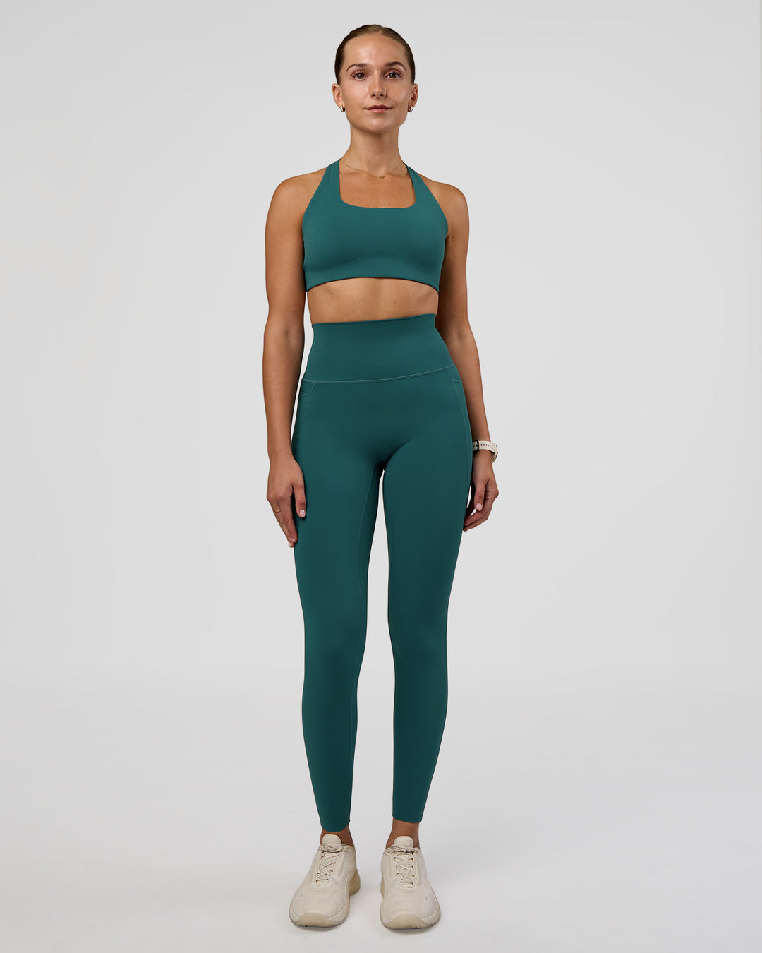 Woman wearing Aspire Sports Bra - Transformative Teal | Model:Myrte | Size:S - view 3