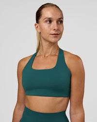 Woman wearing Aspire Sports Bra - Transformative Teal | Model:Myrte | Size:S | Thumbnail Index: 1