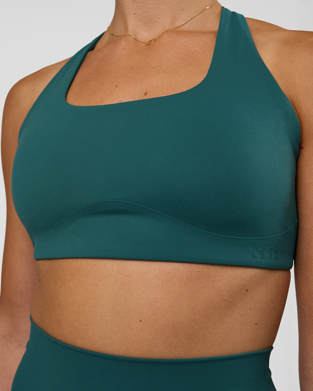 Woman wearing Aspire Sports Bra - Transformative Teal | Model:Myrte | Size:S - view 5
