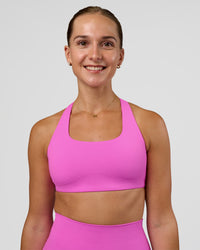 Woman wearing Aspire Sports Bra - Ultra Fuchsia | Model:Myrte | SIze:S | Thumbnail Index: 1
