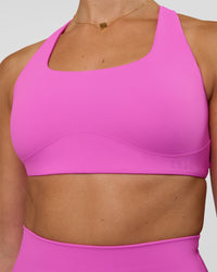 Woman wearing Aspire Sports Bra - Ultra Fuchsia | Model:Myrte | SIze:S | Thumbnail Index: 3