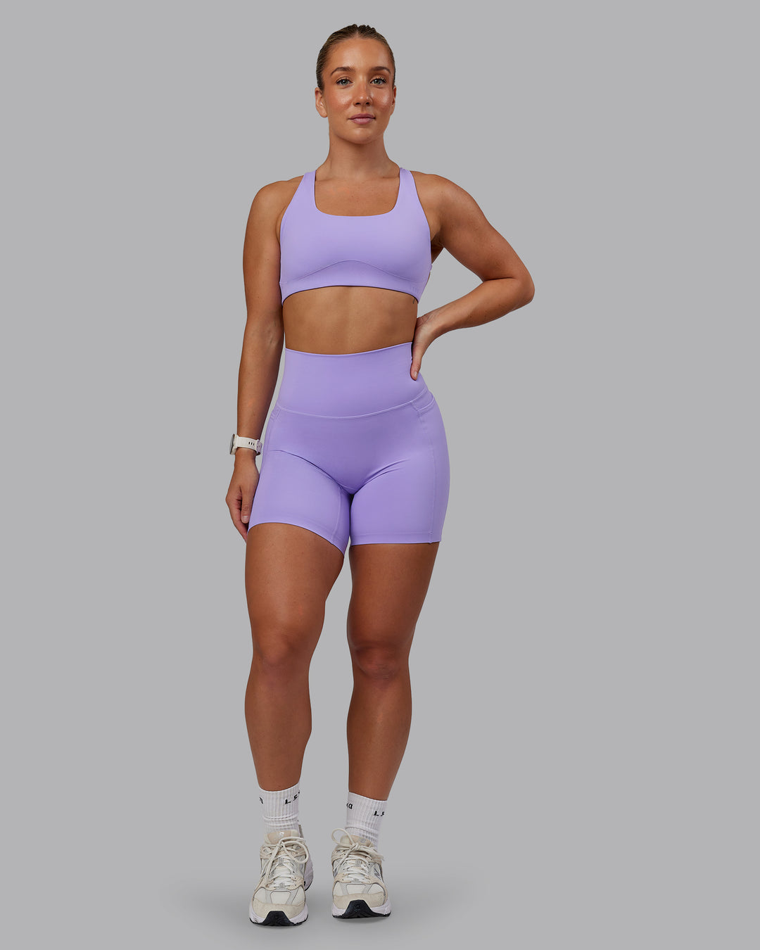 Woman wearing Aspire Sports Bra in Violet Ray | Size:S - view 5