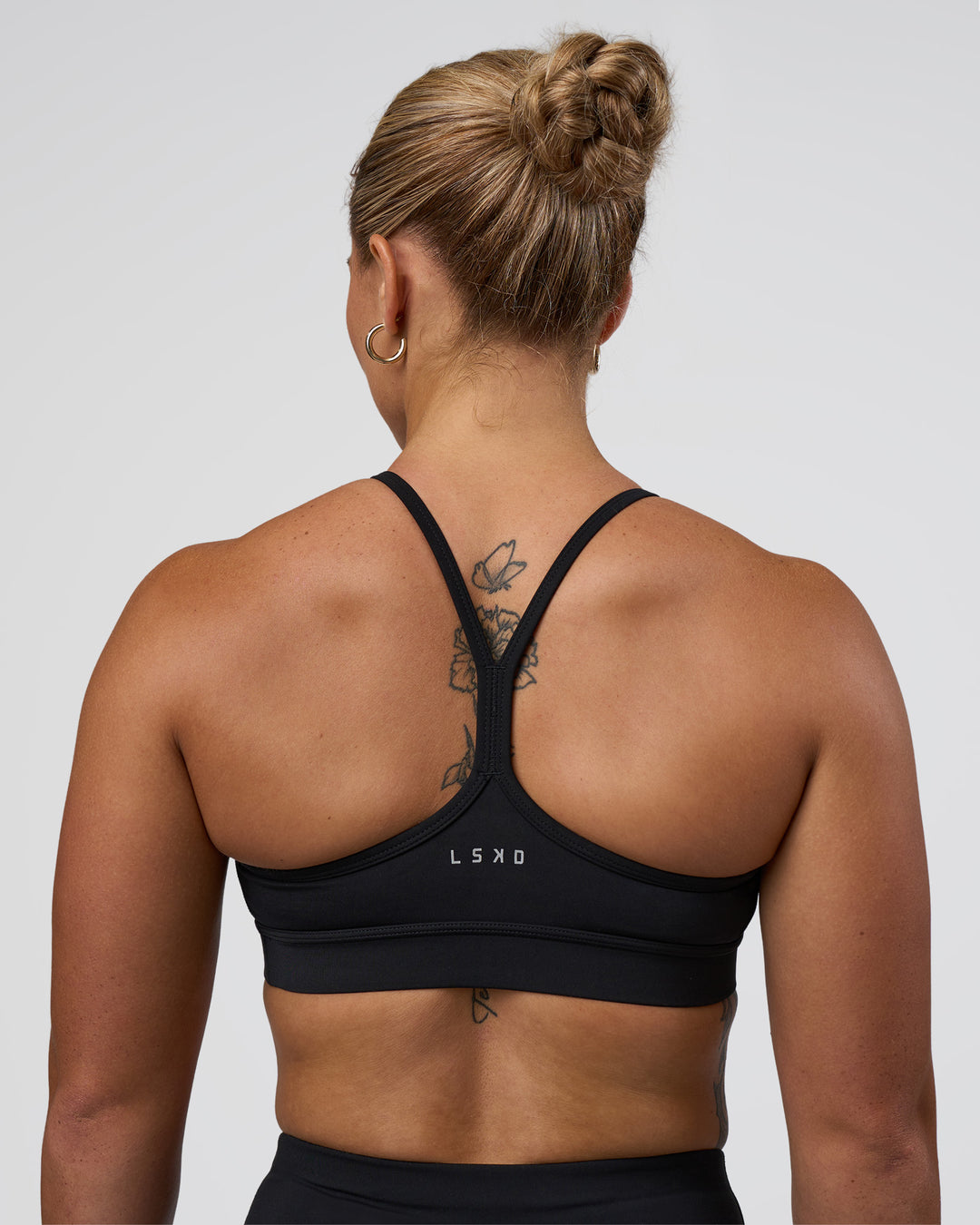 Woman wearing Be Bold Sports Bra - Black | Model:Tenaya | Size:S - view 2