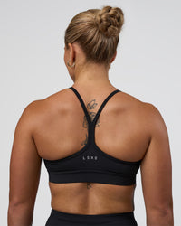 Woman wearing Be Bold Sports Bra - Black | Model:Tenaya | Size:S | Thumbnail Index: 1