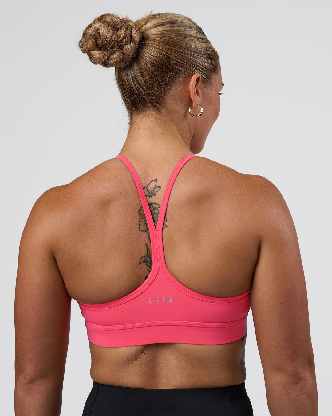 Woman wearing Be Bold Sports Bra - Bright Raspberry | Model:Tenaya | Size:S - view 2