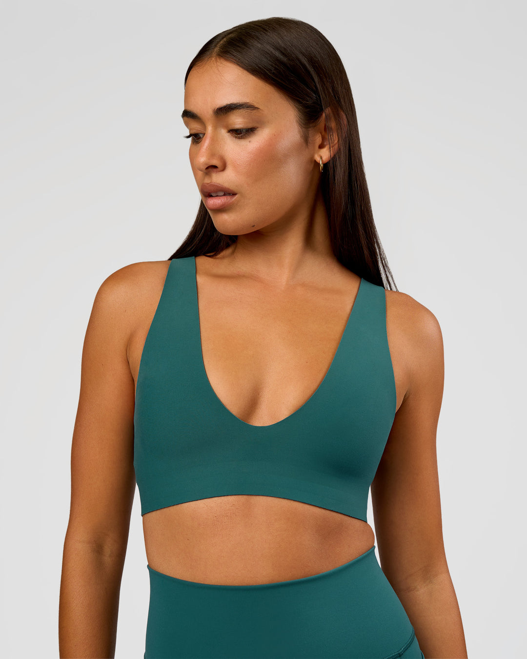 Woman wearing Bend &amp; FLX Plunge Sports Bra - Transformative Teal | Model:Ruby | Size:S - view 6