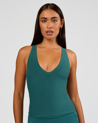 Woman wearing Bend & FLX Plunge Tank - Transformative Teal | Model:Ruby | Size:S | Thumbnail Index: 9