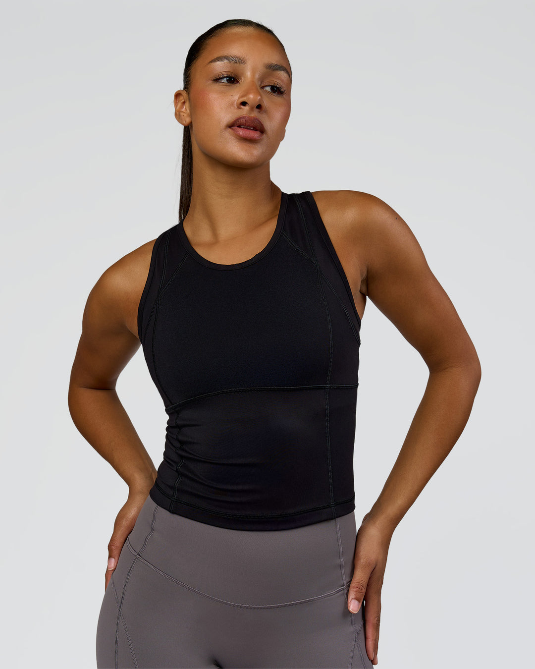 Woman wearing Bend Performance Tank - Black | Model:Rosie | Size:S - view 2