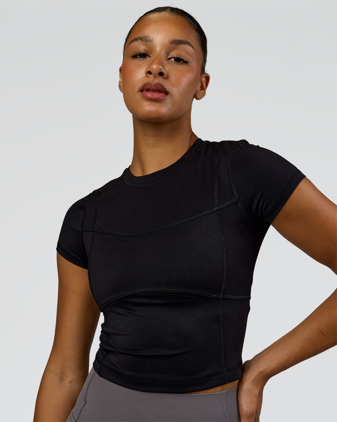 Woman wearing Bend Performance Tee - Black | Model:Rosie | Size:S - view 1