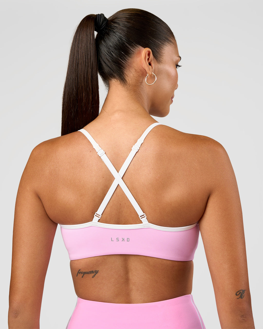 Woman wearing Blushing Sports Bra - Pink Rose-White | Model:Rhiley | Size:S - view 2