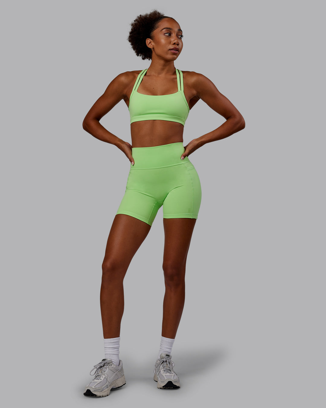 Woman wearing Bree Masters Fusion Ultra High-Rise 6" Short Pockets - Pastel Lime - view 8