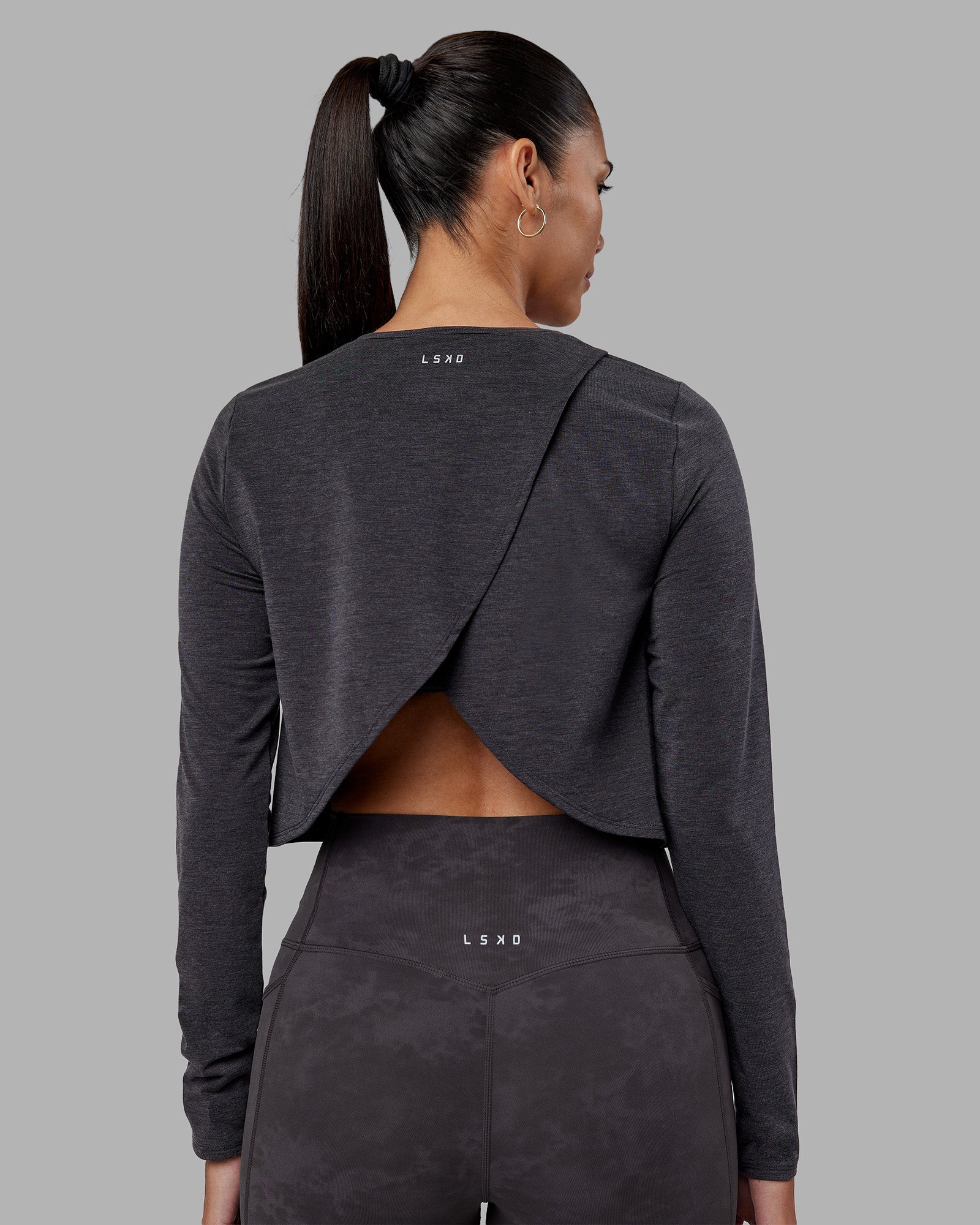 Woman wearing Breeze Long Sleeve Training Tee - Black | Model:Rhiley | Size:S