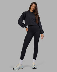 Woman wearing Breeze Open Back Sweater - Black-Black | Model:Phoebe | Size:S | Thumbnail Index: 0
