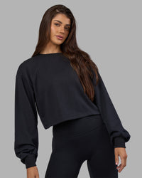 Woman wearing Breeze Open Back Sweater - Black-Black | Model:Phoebe | Size:S | Thumbnail Index: 1