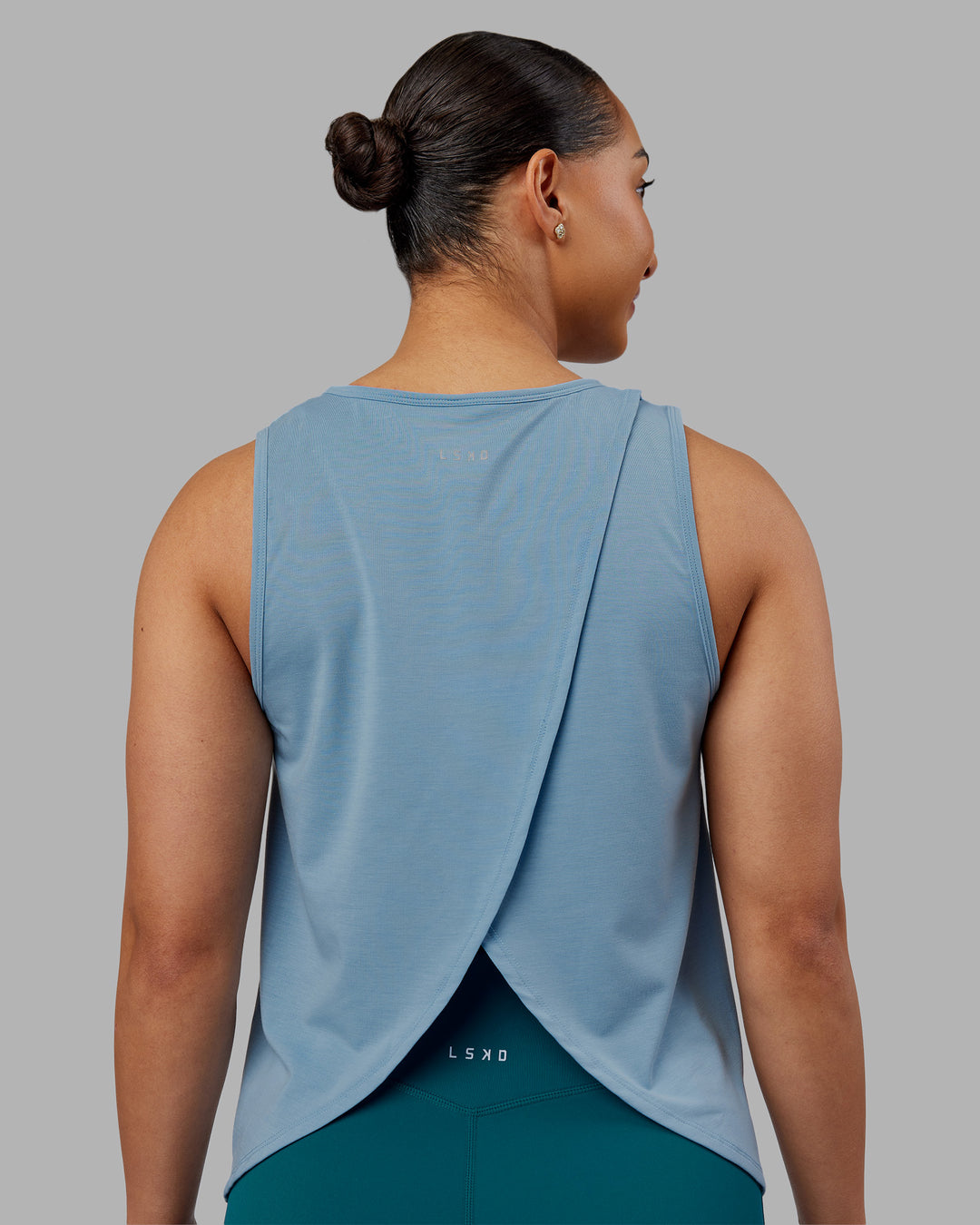 Woman wearing Breeze Training Tank - Glacier Lake | Model:Ayla | Size:S - view 2