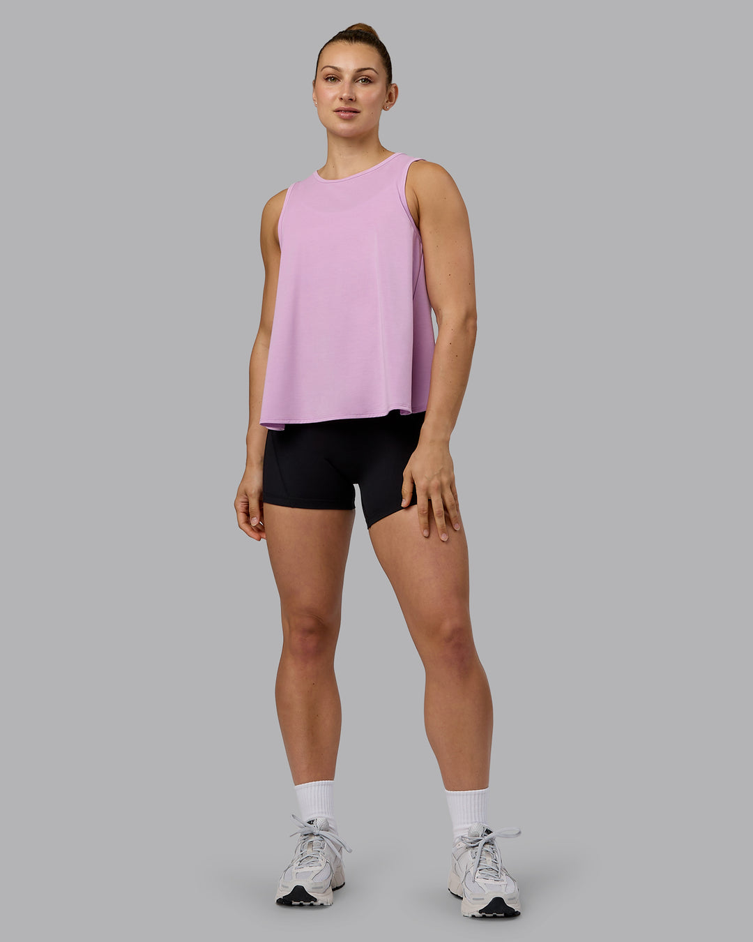 Woman wearing Breeze Training Tank - Pastel Orchid - view 7