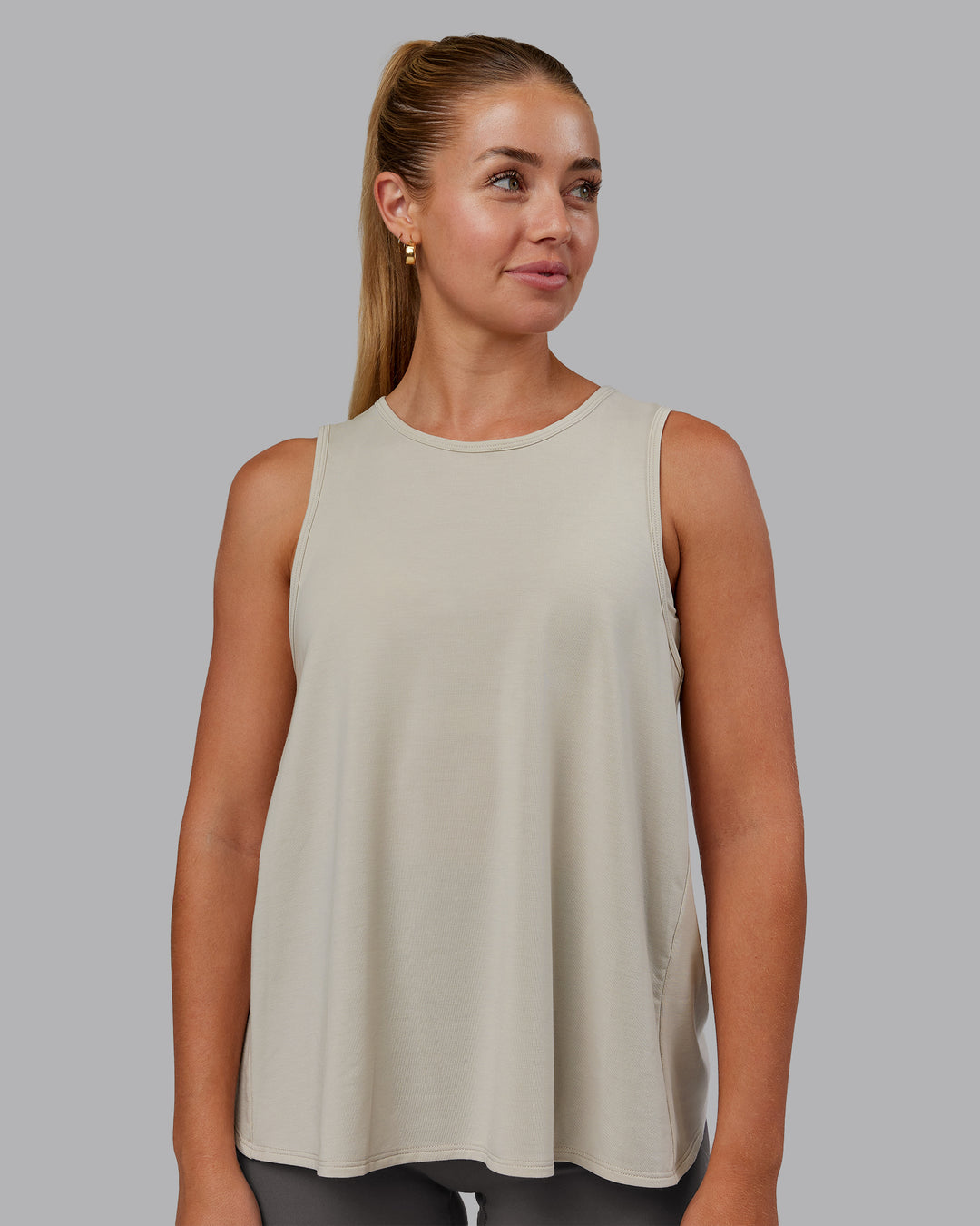 Woman wearing Breeze Training Tank - Shale Beige | Model:Hannah | Size:S - view 1