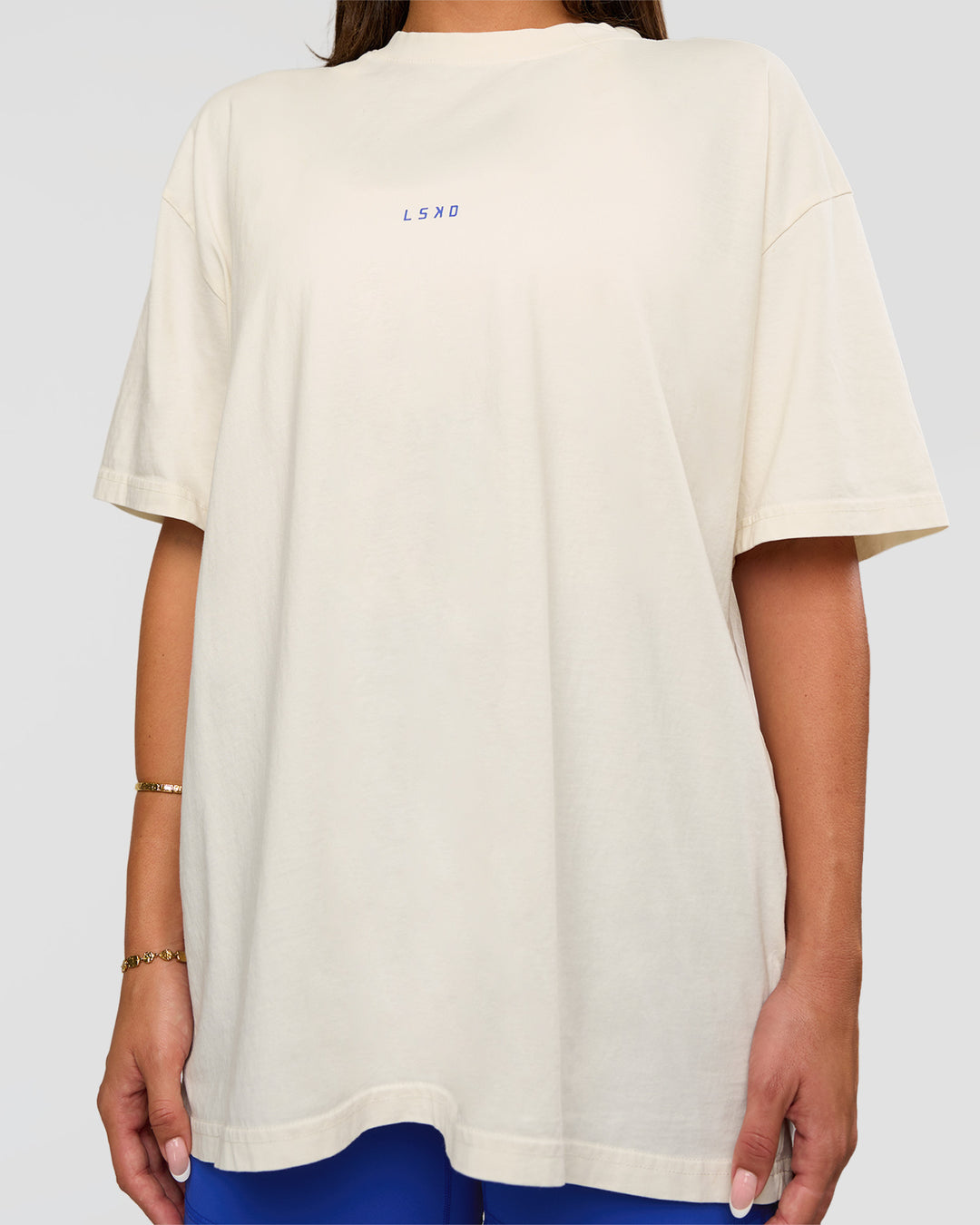 Woman wearing Built On Values Oversized Washed Tee - Off White Washed-Electric Indigo | Model:Bianca | Size:S - view 4