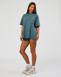 Woman wearing Built On Values Oversized Washed Tee - Transformative Teal Washed-White | Model:Bianca | Size:S | Thumbnail Index: 5