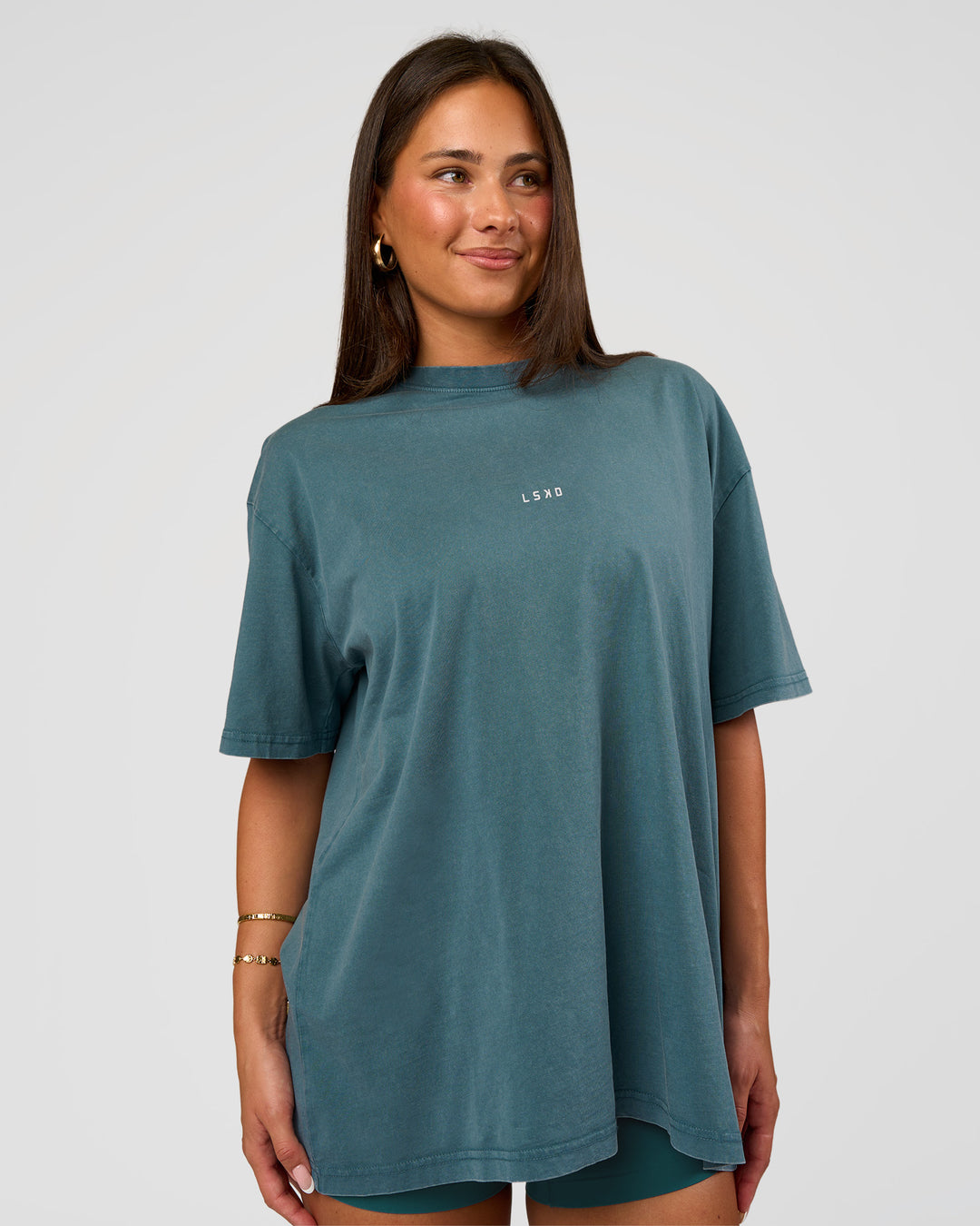 Woman wearing Built On Values Oversized Washed Tee - Transformative Teal Washed-White | Model:Bianca | Size:S - view 2