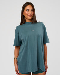 Woman wearing Built On Values Oversized Washed Tee - Transformative Teal Washed-White | Model:Bianca | Size:S | Thumbnail Index: 1