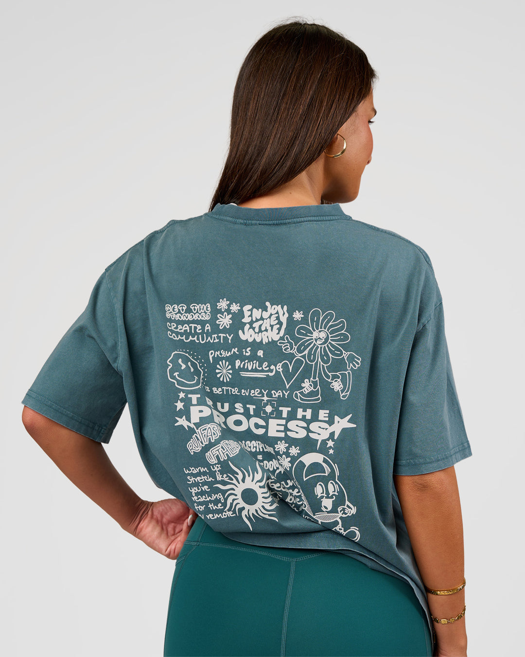 Woman wearing Built On Values Oversized Washed Tee - Transformative Teal Washed-White | Model:Bianca | Size:S - view 1