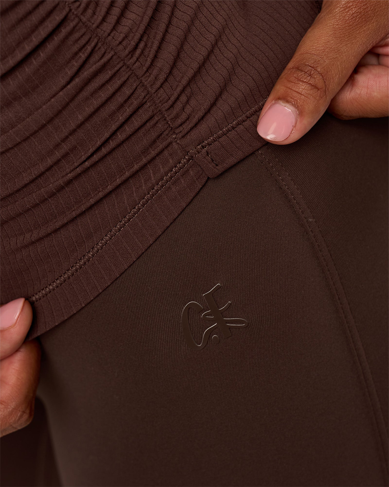 Model wearing CF Fold Over High-Rise Flared Legging - Hot Chocolate | Model:Jordan | Size:S