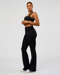 Woman wearing CF Fold Over High-Rise Flared Legging Tall - Black | Model:Rosie | Size:S | Thumbnail Index: 3