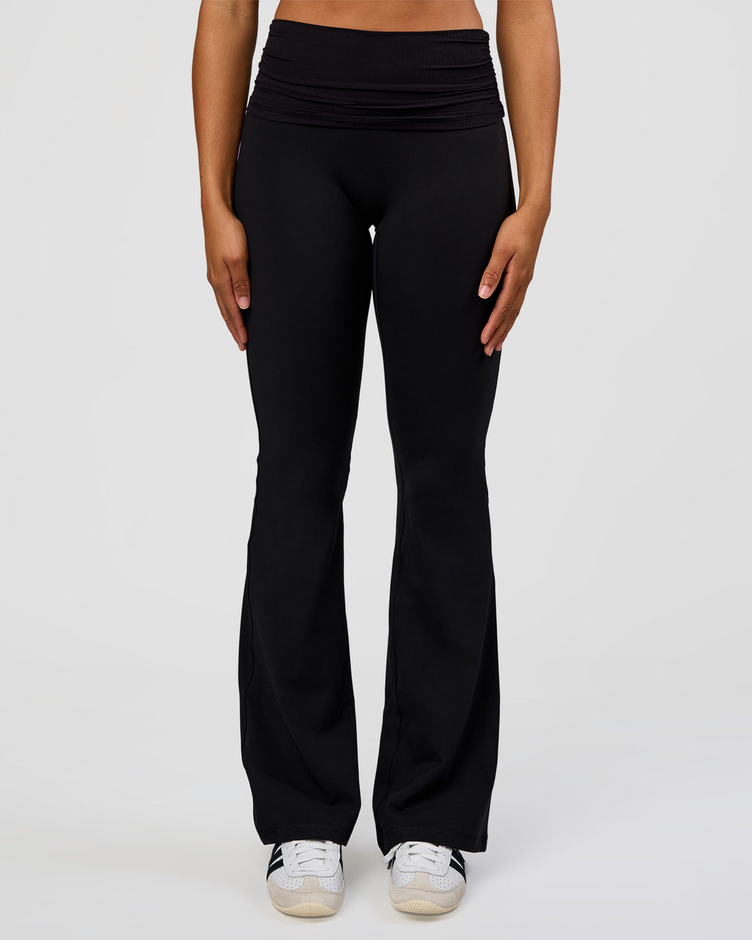 Woman wearing CF Fold Over High-Rise Flared Legging Tall - Black | Model:Rosie | Size:S - view 5