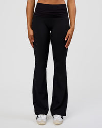 Woman wearing CF Fold Over High-Rise Flared Legging Tall - Black | Model:Rosie | Size:S | Thumbnail Index: 4