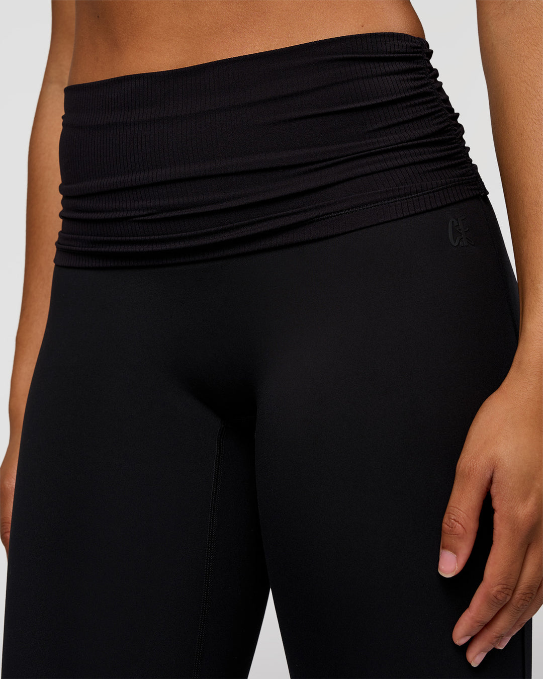 Woman wearing CF Fold Over High-Rise Flared Legging Tall - Black | Model:Rosie | Size:S - view 2