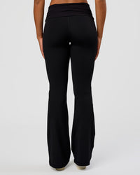 Woman wearing CF Fold Over High-Rise Flared Legging Tall - Black | Model:Rosie | Size:S | Thumbnail Index: 2