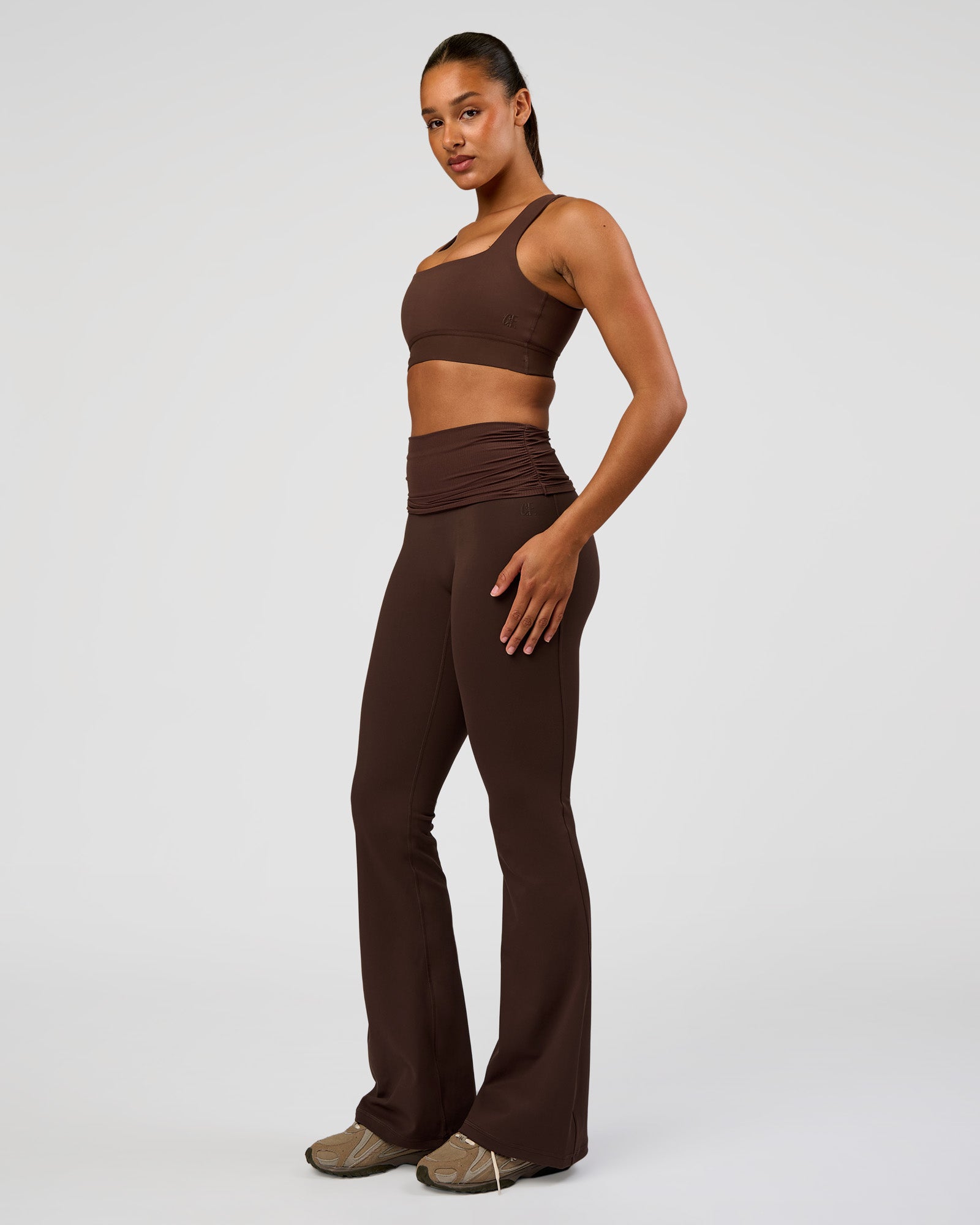 Woman wearing CF Fold Over High-Rise Flared Legging Tall - Hot Chocolate | Model:Rosie | Size:S