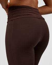 Woman wearing CF Fold Over High-Rise Flared Legging Tall - Hot Chocolate | Model:Rosie | Size:S | Thumbnail Index: 1