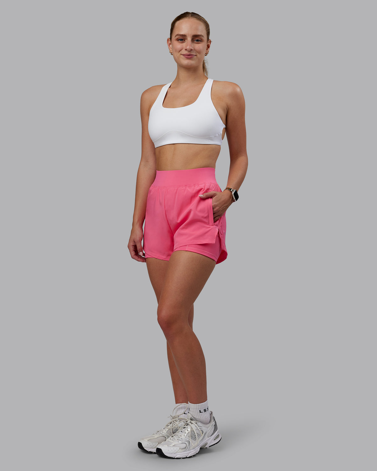 Woman wearing Challenger 3" Lined Performance Shorts in Pink Lemonade | Size:S