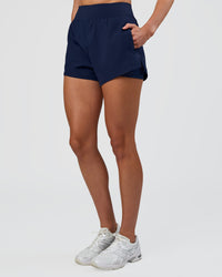 Woman wearing Challenger 3" Lined Performance Short - Future Navy | Model:Evie | Size:S | Thumbnail Index: 2