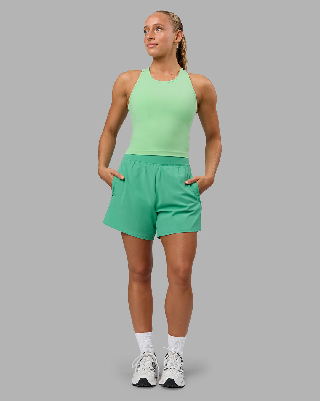 Woman wearing Challenger 5" Lined Performance Shorts - Mystic Green - view 4