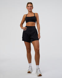 Woman wearing Challenger 5" Lined Performance Short - Black | Model:Amity | Size:S | Thumbnail Index: 0
