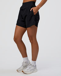 Woman wearing Challenger 5" Lined Performance Short - Black | Model:Amity | Size:S | Thumbnail Index: 2