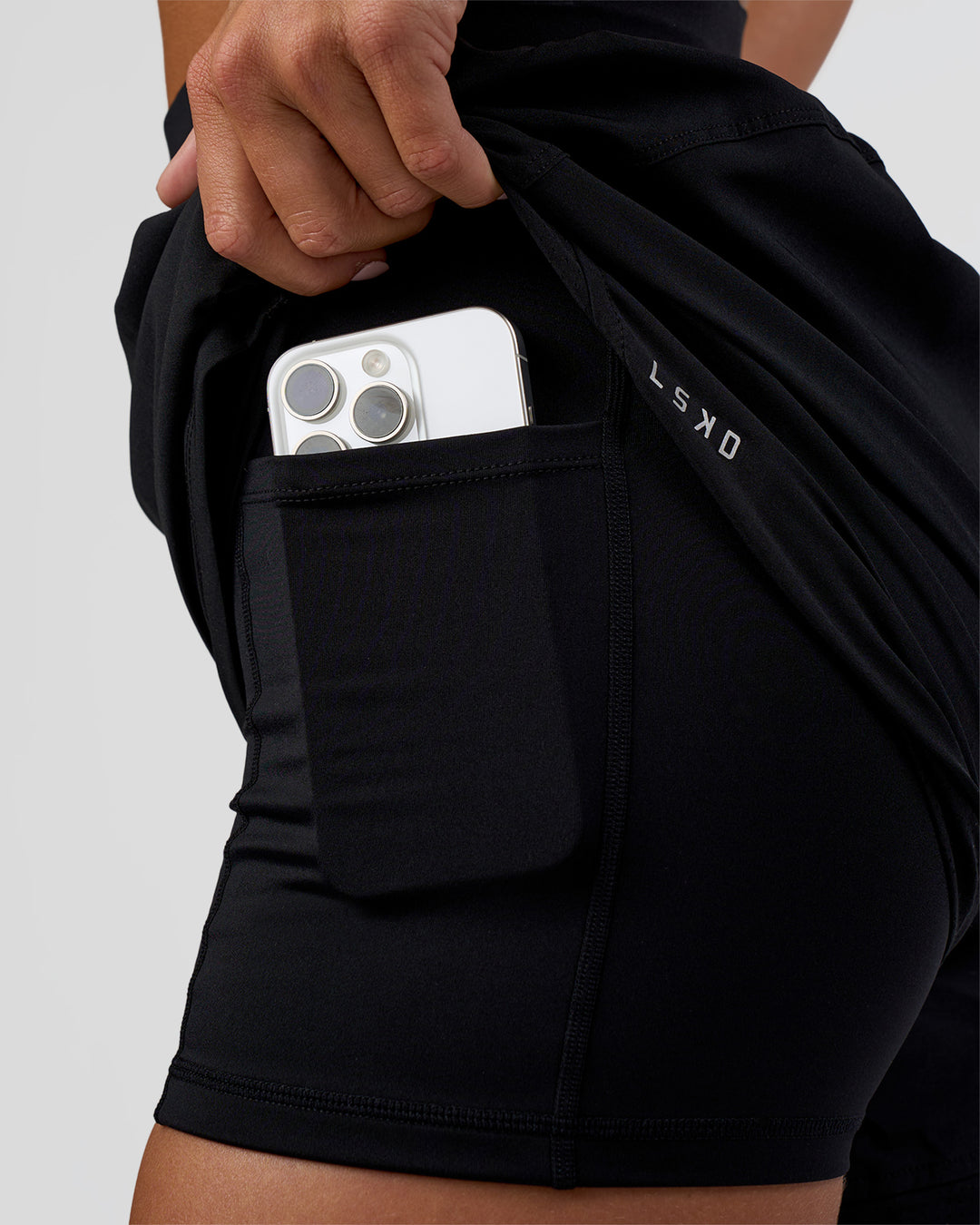 Woman wearing Challenger 5" Lined Performance Short - Black | Model:Amity | Size:S - view 2