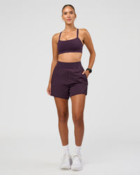 Woman wearing Challenger 5" Lined Performance Short - Midnight Plum | Model:Rhiley | Size:S | Thumbnail Index: 4