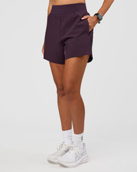 Woman wearing Challenger 5" Lined Performance Short - Midnight Plum | Model:Rhiley | Size:S | Thumbnail Index: 0