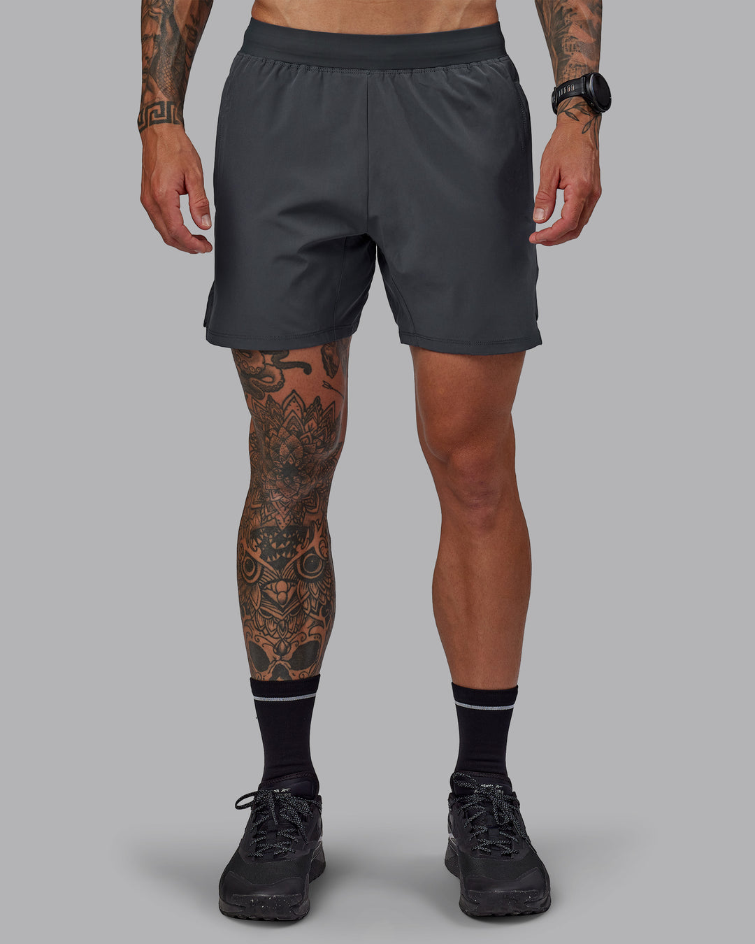 Man wearing Challenger 6" Performance Short in Dark Storm | Size:S - view 1
