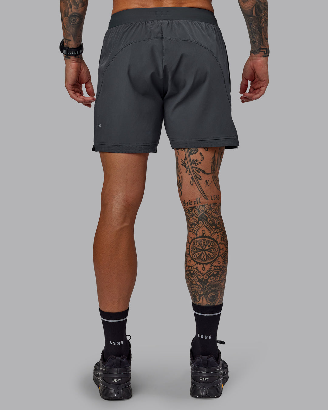 Man wearing Challenger 6" Performance Short in Dark Storm | Size:S - view 4