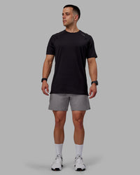 Man wearing Challenger 6" Performance Shorts - Storm Front | Thumbnail Index: 1