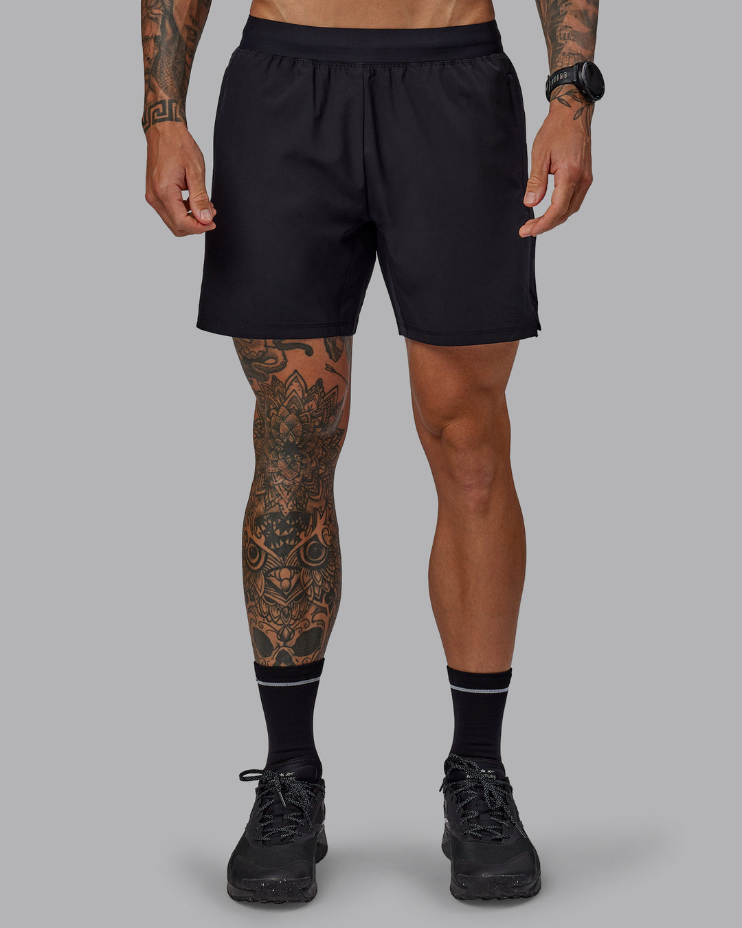 Man wearing Challenger 6" Performance Shorts in Black | Size:S - view 1